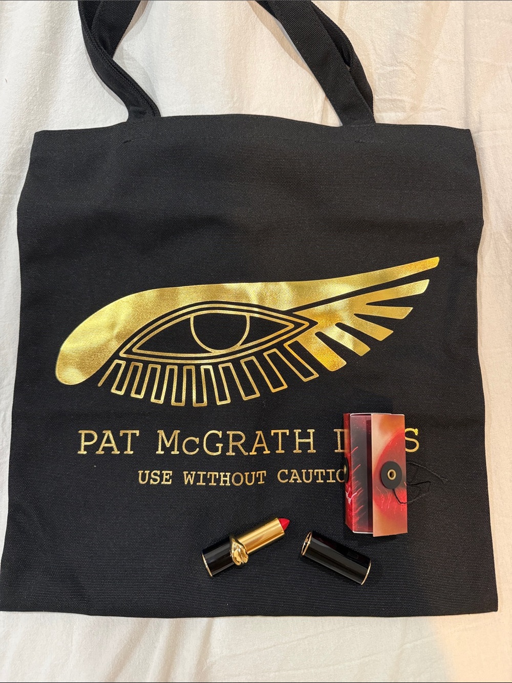 Pat McGrath Black and Gold Logo Tote Bag with Red Lipstick Accent